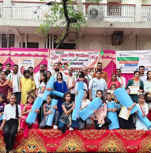 A proud moment distributing yoga mats with the Shaheed Bhagat Singh Foundation, supporting the next generation of yogis.