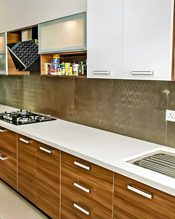 This kitchen showcases a practical and stylish modular design with a mix of wood-finish and white cabinets. I included specialized storage solutions like a pull-down spice rack to ensure every inch of space is used effectively.