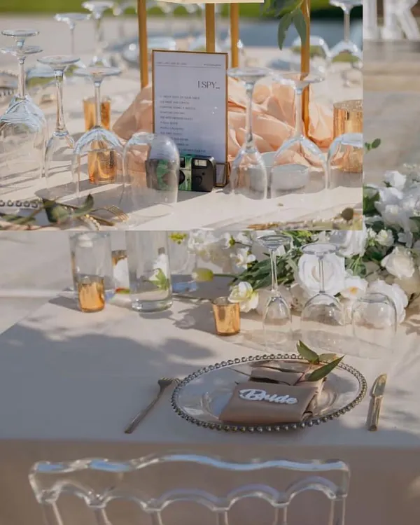 A close-up of an elegant table setting, featuring beaded charger plates, custom 'Bride' place cards, and delicate floral touches.