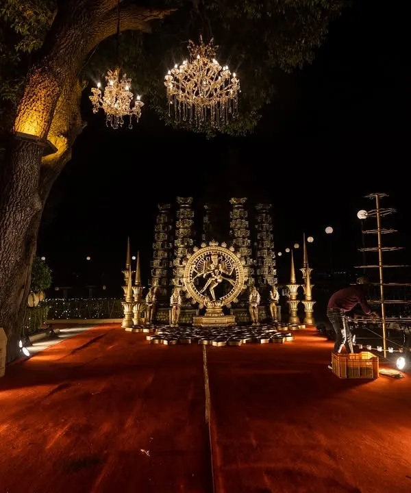 A divine setup featuring a Nataraja statue, creating a powerful and spiritual ambiance for a night event at Jagmandir Island Palace.