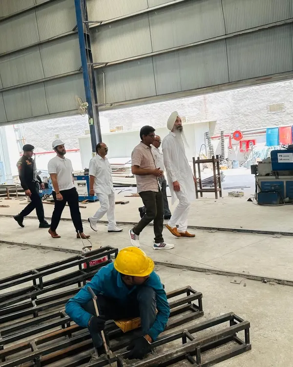 We were honored to welcome a prestigious client to our manufacturing facility. Here, a worker is focused on his craft while our team leads a tour, showcasing our commitment to quality from the ground up.
