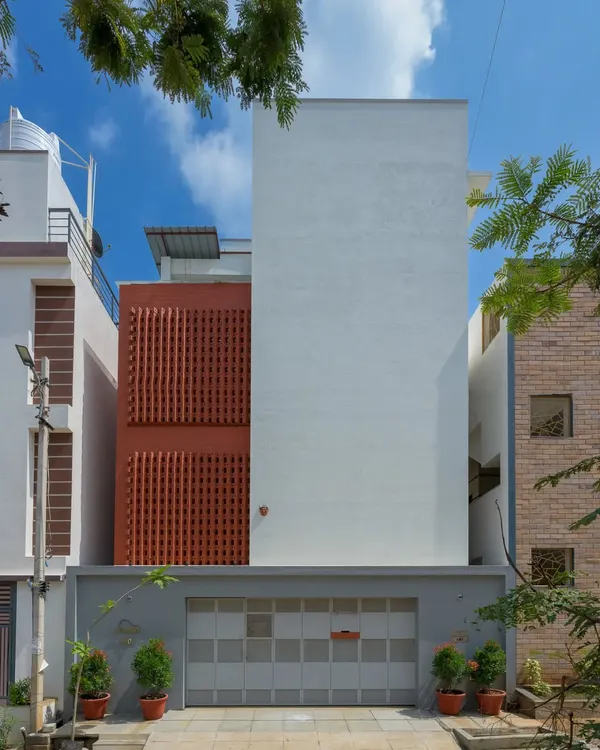 The sole design element of this home's exterior is the solid mass of brick, which stands still and bold. The dynamic play of light and volumes is revealed only once you step inside.