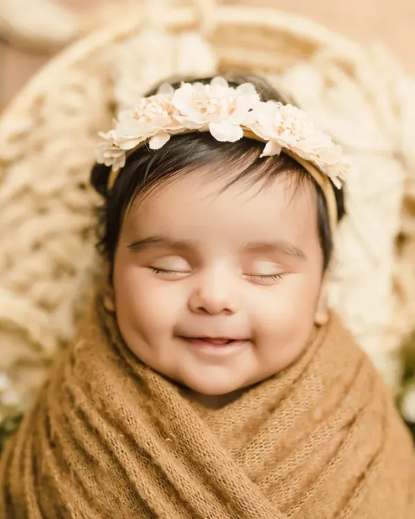 That dimpled smile! This is the kind of precious, happy moment we love to capture. A simple, close-up portrait lets your baby's personality shine.