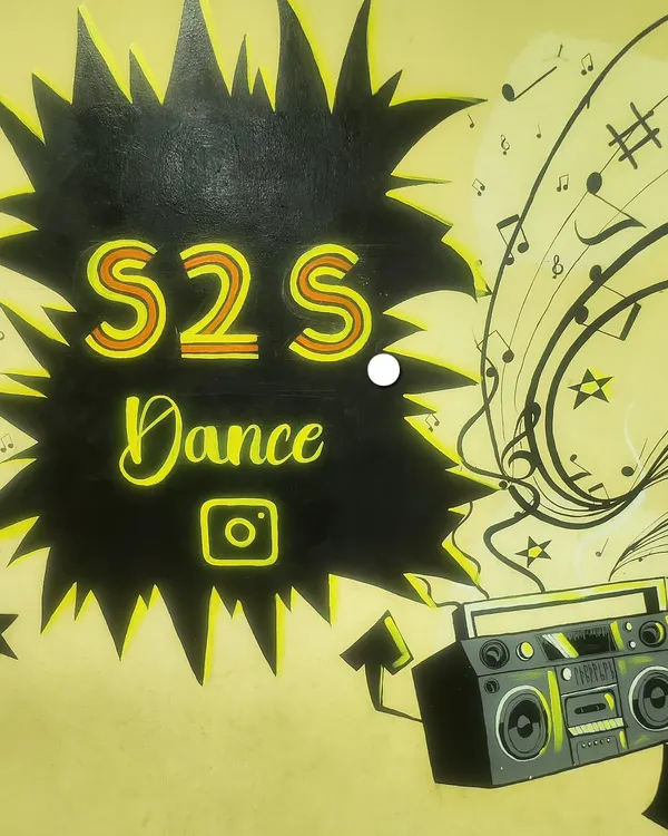 A close-up of our studio's wall art. I wanted to create a space that screams energy, music, and dance from every corner.