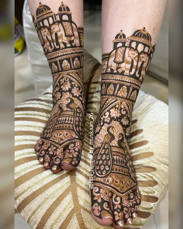 A classic and rich bridal feet design. This full coverage henna features majestic peacocks and royal elephants, with detailed patterns covering the entire foot for a stunning look.