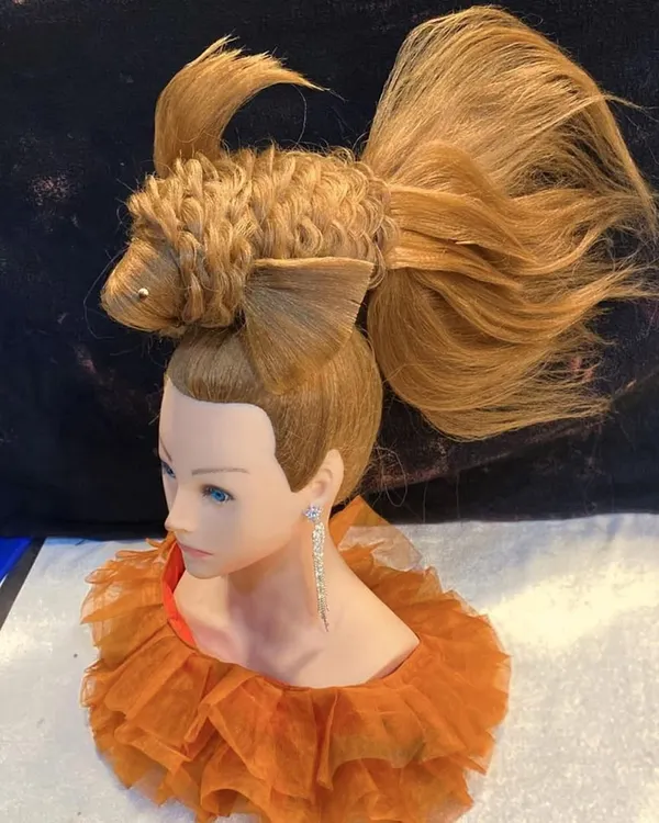 This is what I mean by 'no limits' in hairstyling. I teach my students how to think beyond the basics and create true hair art, like this intricate fish sculpture, using advanced structural techniques.