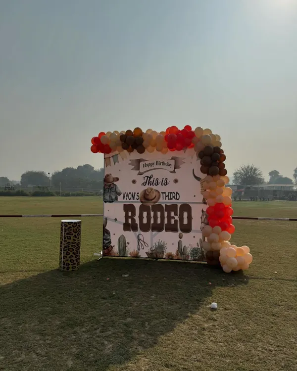 A custom "Rodeo" themed birthday backdrop set up on the lawn. I can accommodate various party themes to make your child's day extra special.