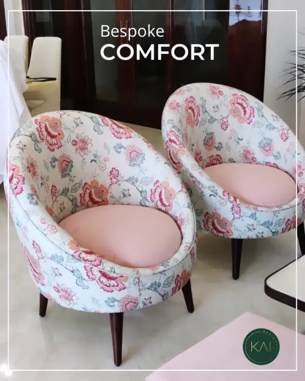 A pair of bespoke barrel chairs we upholstered in a vibrant floral fabric with soft pink seats. These chairs were designed to add a touch of bespoke comfort and personality to a client's sunroom.