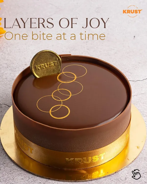 Layers of joy, one bite at a time. This is my classic Belgian chocolate truffle cake, featuring a perfect mirror glaze and our signature gold emblem, promising pure chocolate indulgence.