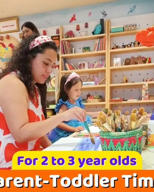 I love hosting parent-toddler time for our 2 to 3-year-olds. It's a wonderful opportunity for parents to engage in creative activities with their children, like this painting session.