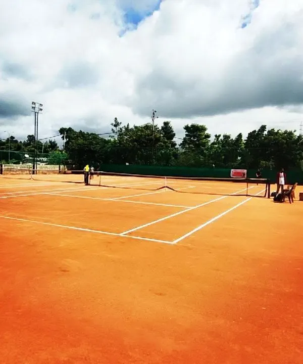 A wide view of my professionally maintained clay courts at the Tennis360 academy, prepared for a day of competitive tournament matches.