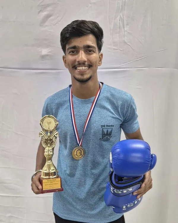 Aman Dulgaj after securing the Gold Medal and the coveted 'Best Boxer' award at the Mumbai University Championships. This is the level of excellence we strive for.
