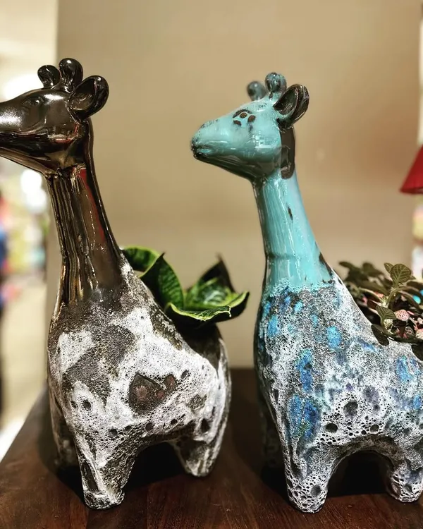 Come check out my new animal planters collection. These giraffe pots feature a unique mix of glazing and a rough Atlantis finish, making them a fun and artistic home for your favorite small plants.