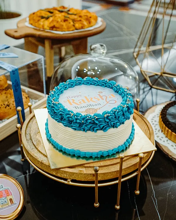 My Raksha Bandhan burn away cake is the ultimate surprise for your sibling. The top layer with the festive message burns away to reveal a special picture of you two underneath.
