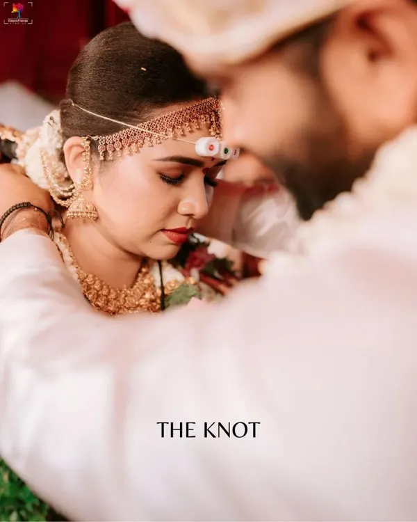 The sacred moment of tying the knot, captured with an intimate, emotional focus. We believe these quiet, profound rituals are the heart of a wedding story, and we aim to preserve their sanctity in our candid ceremony photography.