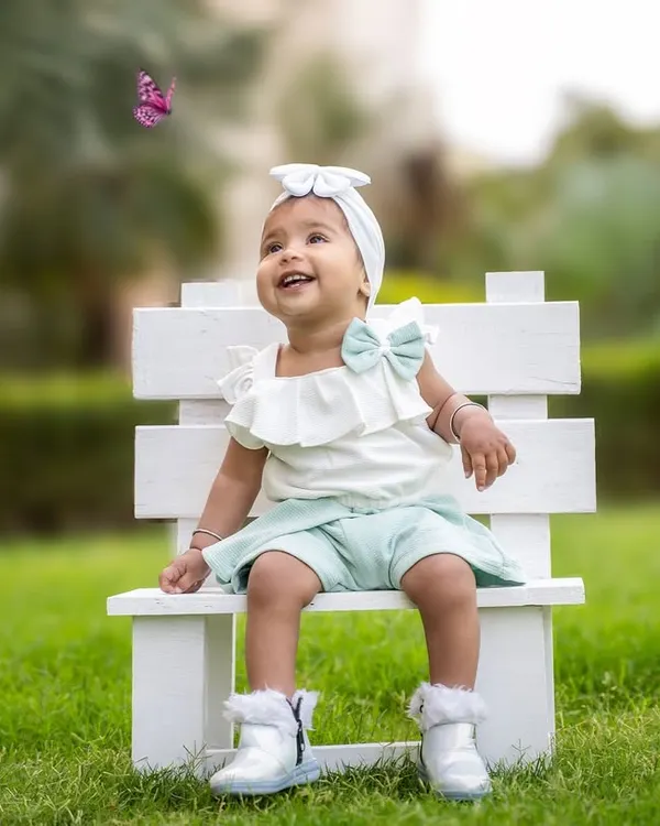 This is the kind of magic I live to capture. A moment of pure wonder as this little one discovers a butterfly during her first birthday outdoor session.