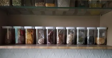 This is the result of decanting pantry staples into uniform, airtight containers. Not only does it look beautiful, but it also keeps food fresh and makes it easy to see what you have.