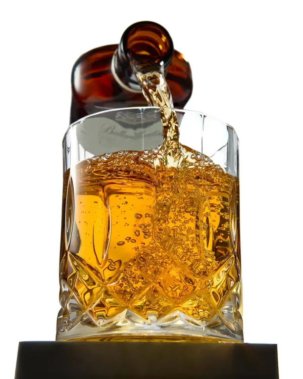 Capturing the perfect whiskey pour is all about timing and light. For this shot, I focused on freezing the motion to show the rich amber color and the energy of the splash, creating a sense of elegance and movement for beverage brands.