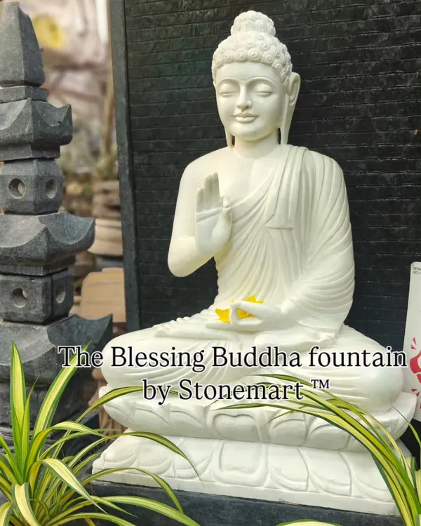 This close up shows the serene expression and intricate details of our 5-foot Blessing Buddha fountain. The statue is hand carved from a single block of pure white marble and sits before a granite waterfall, creating a tranquil centerpiece for any large home or garden.