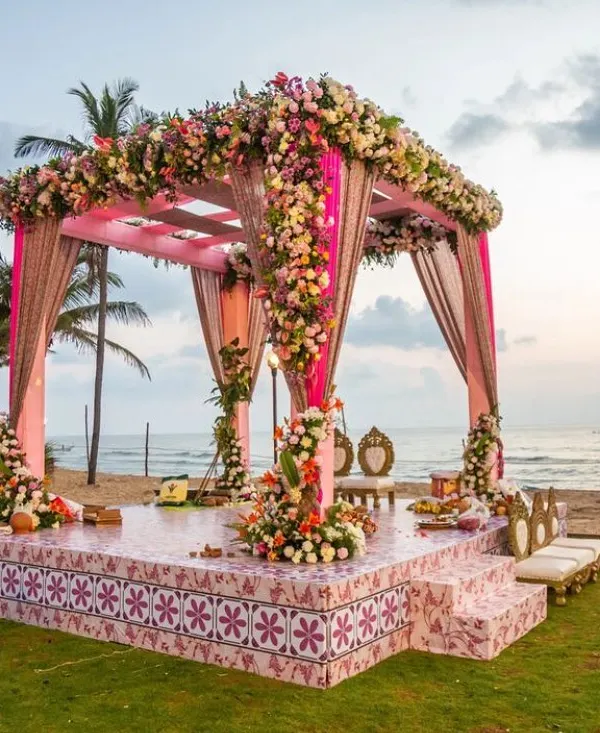 A breathtaking beachside mandap where dreams meet reality. I designed this pastel floral setup to complement the serene ocean backdrop, creating a truly magical space for the wedding ceremony.