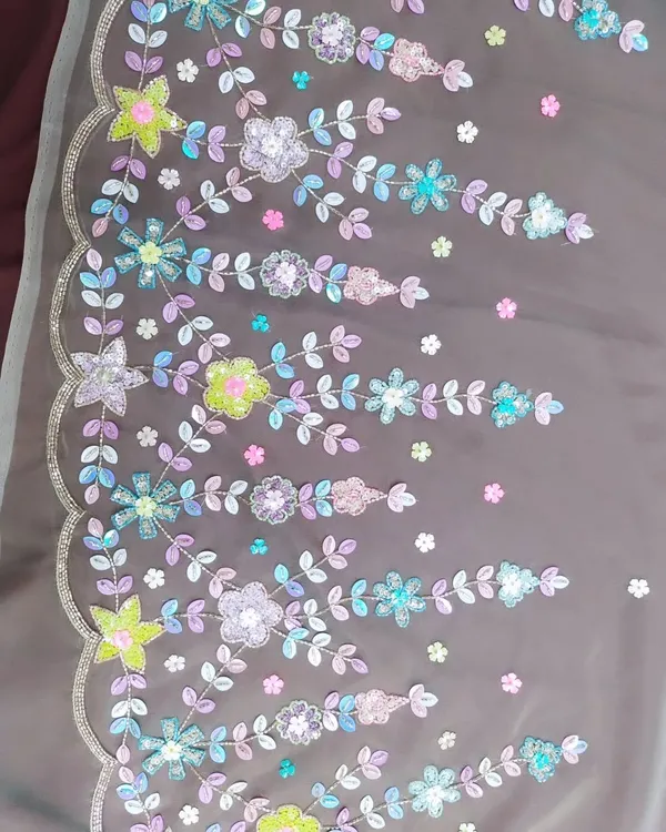 A close-up of the colorful floral hand embroidery I created for a light gold lehenga. Instead of traditional gold or silver, I used a pastel palette of sequins and beads to create a fresh, modern, and whimsical design.