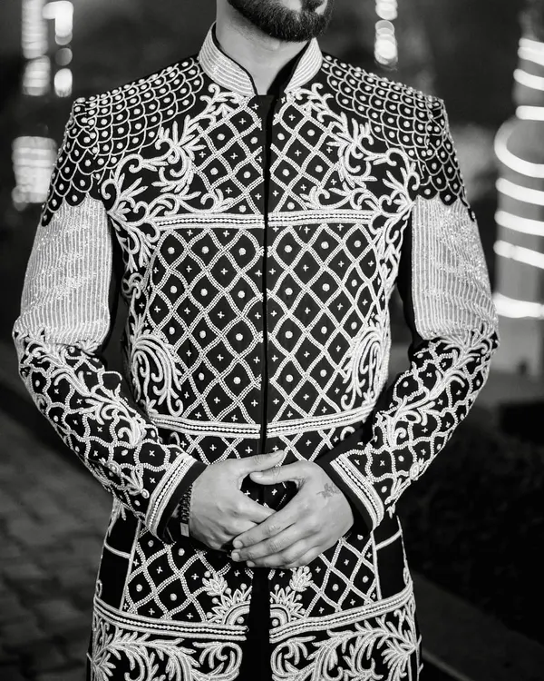 This is the essence of my craft. A black Indo-western jacket where every detail, from the intricate ivory hand embroidery to the lustrous embellishments, is meticulously placed to create a piece that is both bold and timeless.