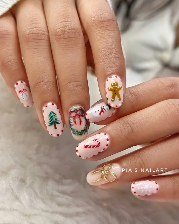 The cutest holly jolly Christmas nails. This set has it all: a hand-painted gingerbread man, Christmas tree, snowman, candy cane, and a 3D gold bow.