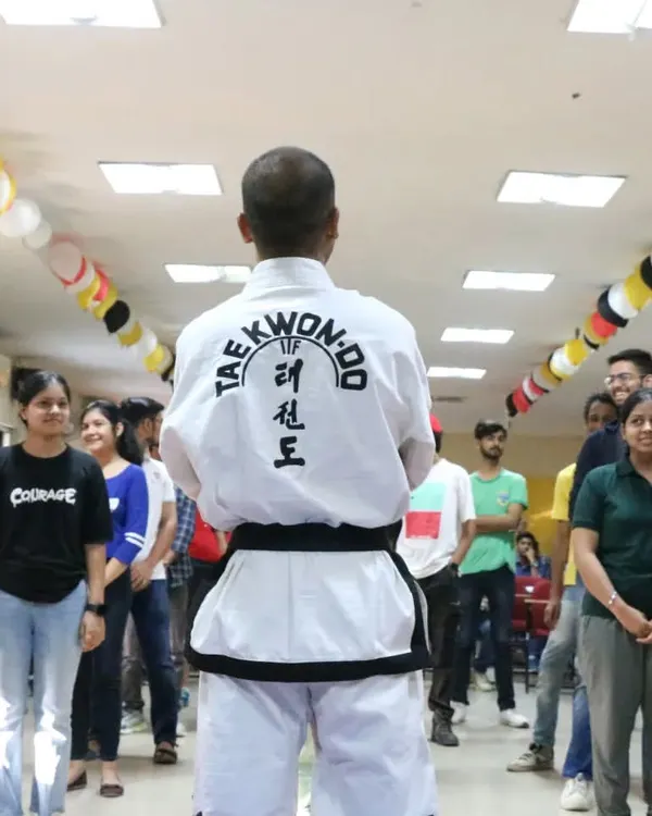Addressing a group of students at the start of a self-defense workshop. I always begin by setting the context: this is about empowerment, awareness, and building confidence, not aggression.
