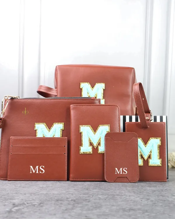 This is my Monogram Travel Combo in a classic tan color. The set includes a full range of personalized accessories, from a passport cover and luggage tag to pouches and card holders, all featuring a custom initial for a coordinated and stylish travel experience.