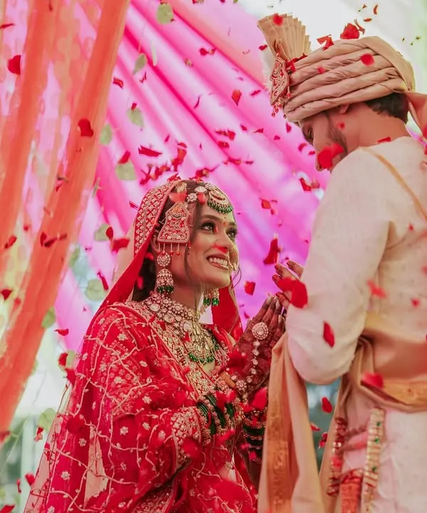 A truly magical moment from the wedding ceremony, as flower petals rain down on Tejal and Chetan. I focus on capturing these unscripted, emotional exchanges that you will cherish forever.
