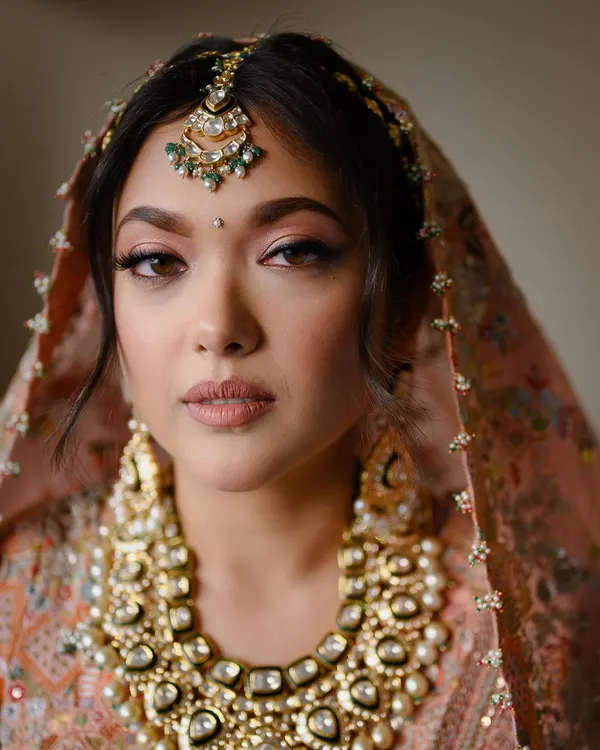 A classic bridal portrait that focuses on the intricate details of the bride's attire and her calm, confident expression. I use soft, natural light to highlight features and create a timeless, high-end look that still feels completely authentic to you.