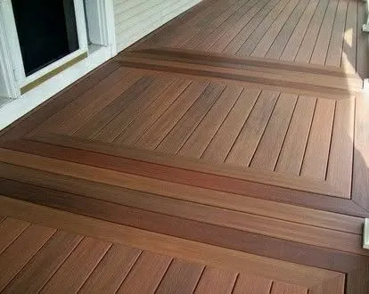 A close-up of a masterfully crafted wooden deck. The design features intricate inlay patterns, showcasing our attention to detail and high level of carpentry skill.