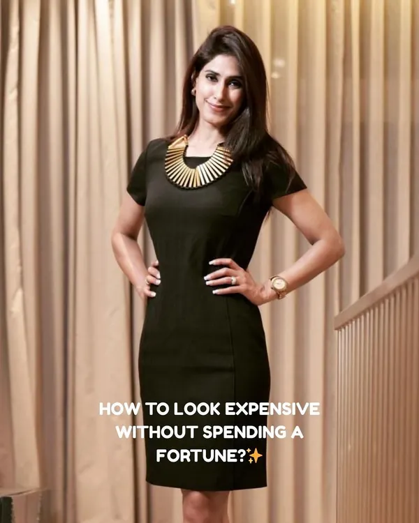 This is the question I help every client answer. Looking polished and expensive isn't about the price tag; it's about strategy. In this full-length shot, I'm wearing a classic black sheath dress with a statement gold necklace, demonstrating how a well-fitted silhouette and the right accessory create a powerful, high-value impression.