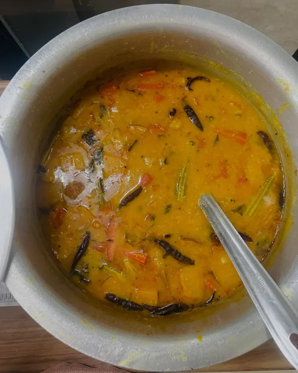 A comforting bowl of our homemade Sambhar, cooked with vegetables and lentils. It's the perfect accompaniment to our South Indian dishes.