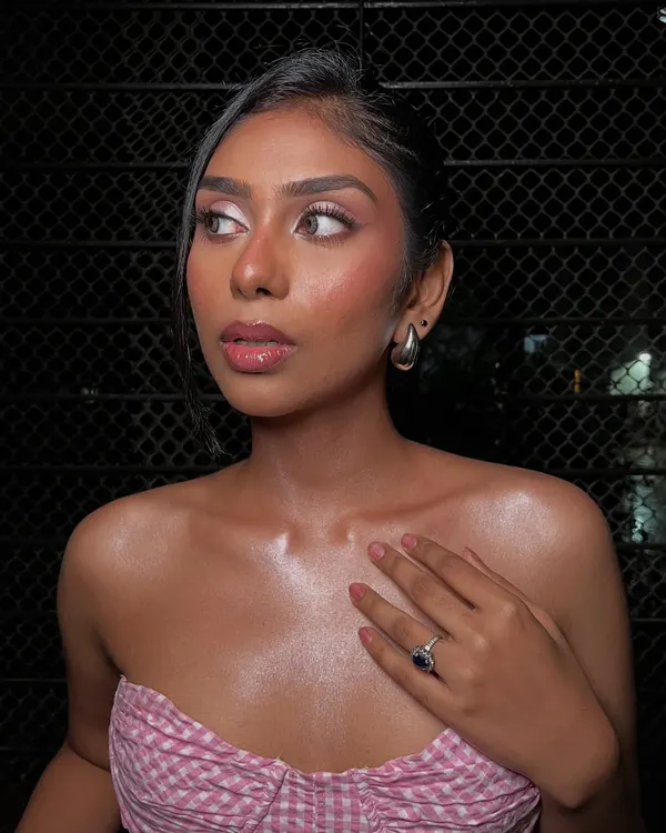 A beautiful profile shot of this pretty-in-pink look. The focus is on dewy, glowing skin and soft pink tones on the eyes, cheeks, and lips.