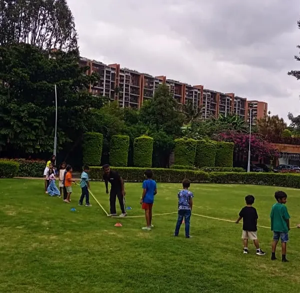 It's team versus team in a classic game of tug-of-war on a lush green lawn. This game is always a highlight of our outdoor parties.