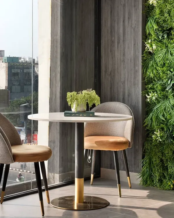 This corner of our modern office project is a perfect haven for deep work. A lush green wall adds a touch of organic drama, proving that even the most modern spaces can nurture the soul.