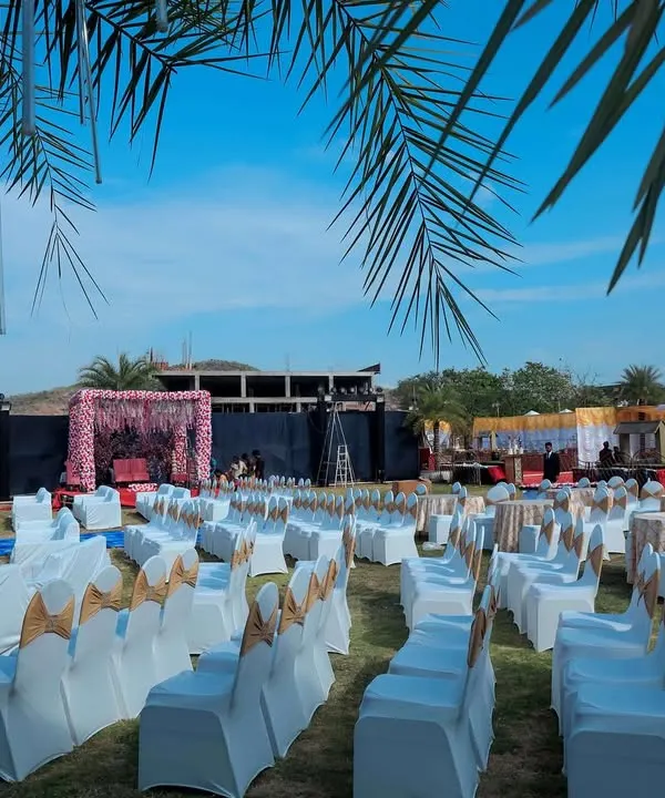 A wide view of an outdoor wedding setup at a destination resort. We arranged the guest seating to provide a clear view of the main stage, ensuring everyone feels part of the ceremony.