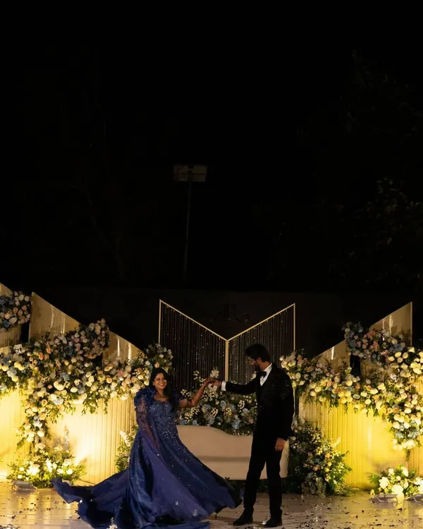 Every love story is a fairytale, and we planned Raksha and Ram's reception to feel just like one. Here they are, having their first dance on a stage filled with flowers, creating a truly magical moment.
