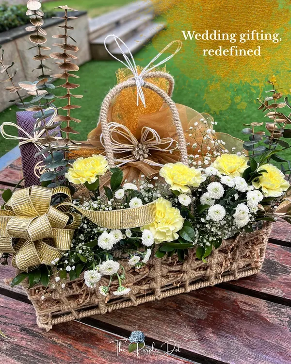 I believe in redefining wedding gifting, turning it into an art form that tells your unique story. This hamper, overflowing with fresh flowers and thoughtfully chosen gifts, is a perfect example of how I blend abundance with elegance, creating a moment that feels both grand and deeply personal.