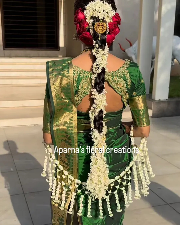 This bride is wearing one of my signature Thai-pattern shelas. I weave each jasmine bud by hand to create this intricate floral shawl, a truly special accessory for a wedding day.