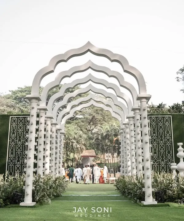 First impressions are everything. I designed this dramatic, all-white architectural walkway to create a sense of awe and anticipation, guiding guests into a celebration that was both grand and elegant.
