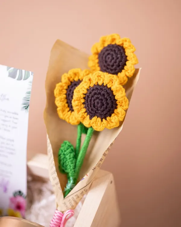 A charming bouquet of handmade crochet sunflowers, a unique and lasting floral touch that I include in many of my personalized birthday hampers.