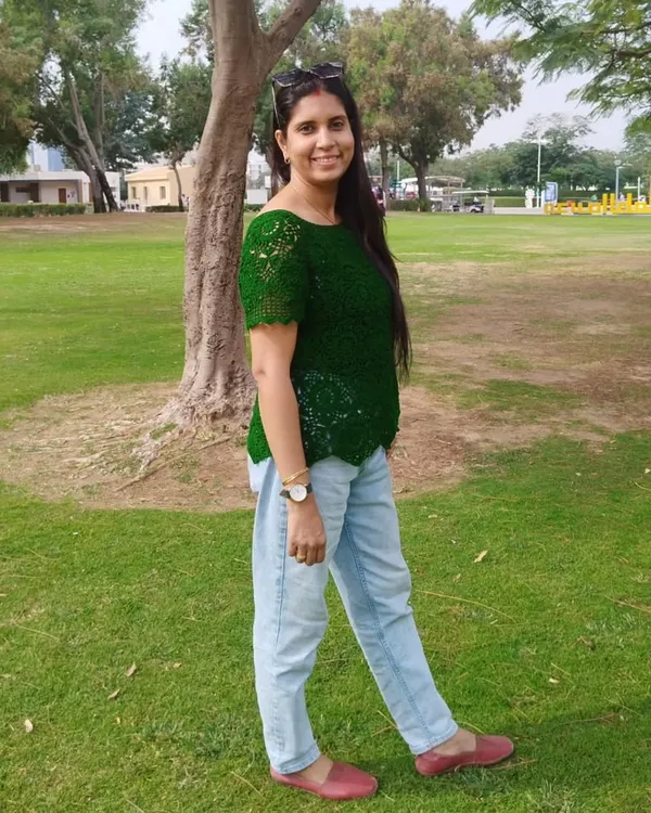 Here I am, wearing my favorite green lace top. It’s so comfortable and versatile, I love pairing it with simple jeans for a casual day out. It’s proof that handmade can be both elegant and effortless.