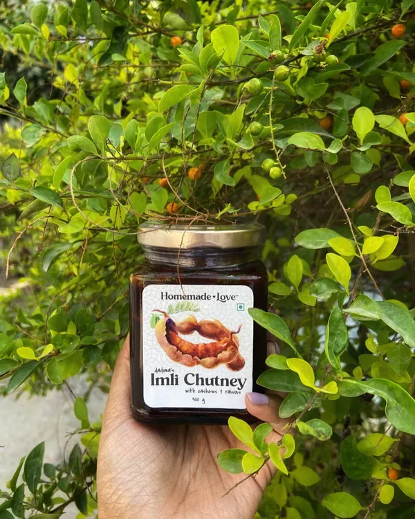 Here is my dadima's Imli Chutney, held against a backdrop of fresh greenery. It's a reminder that I only use natural ingredients to create that unforgettable sweet and tangy flavour.