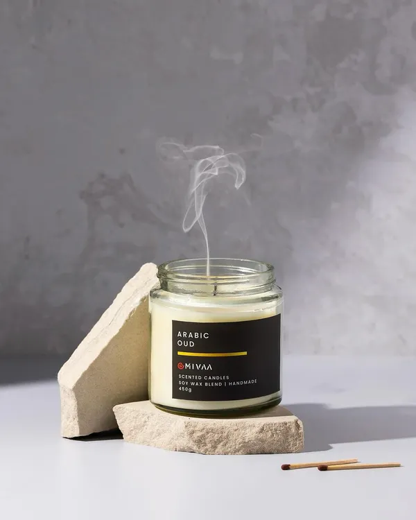 A continuation of the candle shoot, this image captures the delicate wisp of smoke after the flame is extinguished, adding a sense of calm and narrative to the product story.