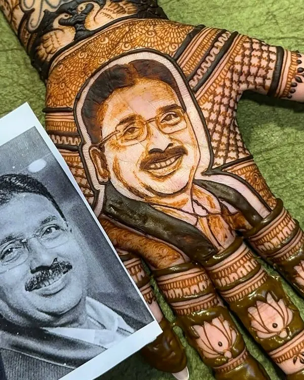 I can turn your favorite photo into a beautiful mehndi portrait. This design shows the fresh henna paste right next to the client's reference picture of her father, capturing his likeness with my 100% natural mehndi.