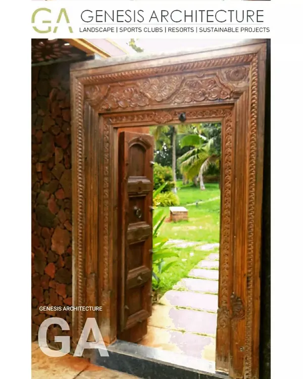 An antique carved wooden door opens to a lush garden path at a 3-acre farm land project near Bangalore. We developed this property as a holiday destination, planting over 250 native trees to support local bird life and create a true nature getaway.