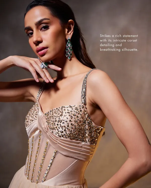 A detailed look at the corsetry of the Bella Gown. The sheer panels are combined with structured boning and hand-applied sequins to create a piece that is both delicate and strong.