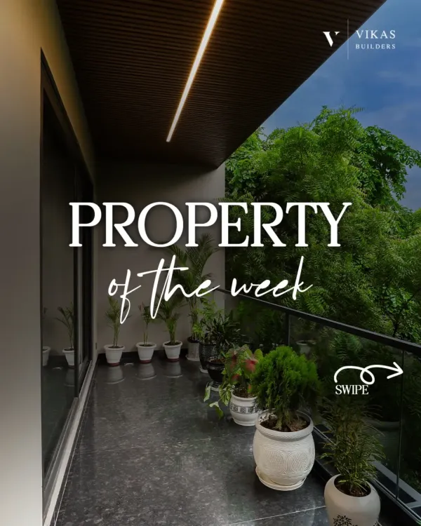 This is our property of the week, featuring a beautiful balcony with lush greenery. The space is designed as a peaceful escape, with dark flooring and a wood-paneled ceiling.